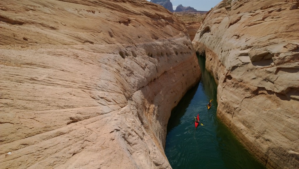Clint Spahn and Brendyce Budd kayak through a Face canyon in Lake Powell.
